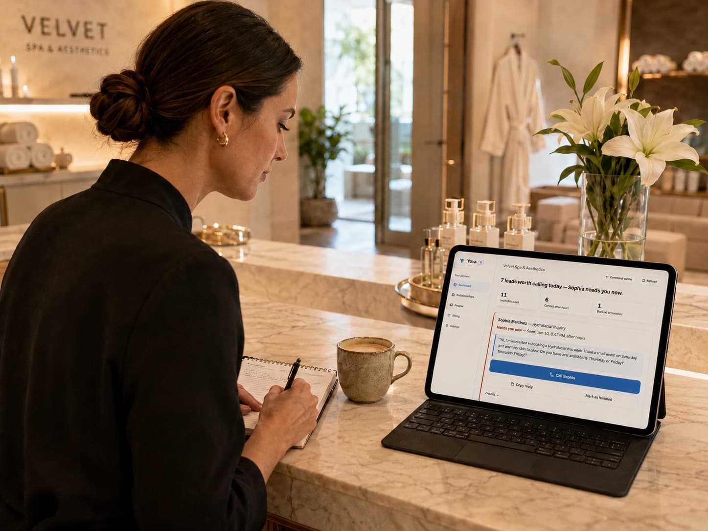 A med-spa owner at the reception desk, reviewing her Yova call-back list on a tablet.